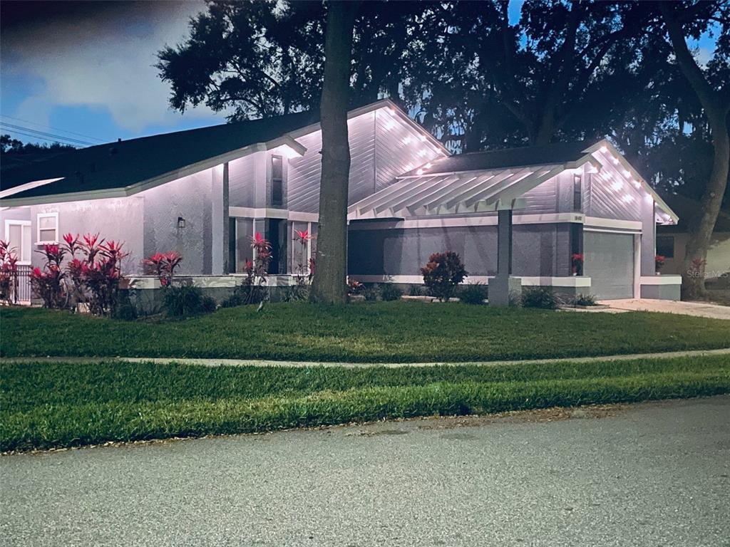 1862 Wind Willow Road Belle Isle, FL 32809 - Photo 25 of 42 a front view of a house with a garden