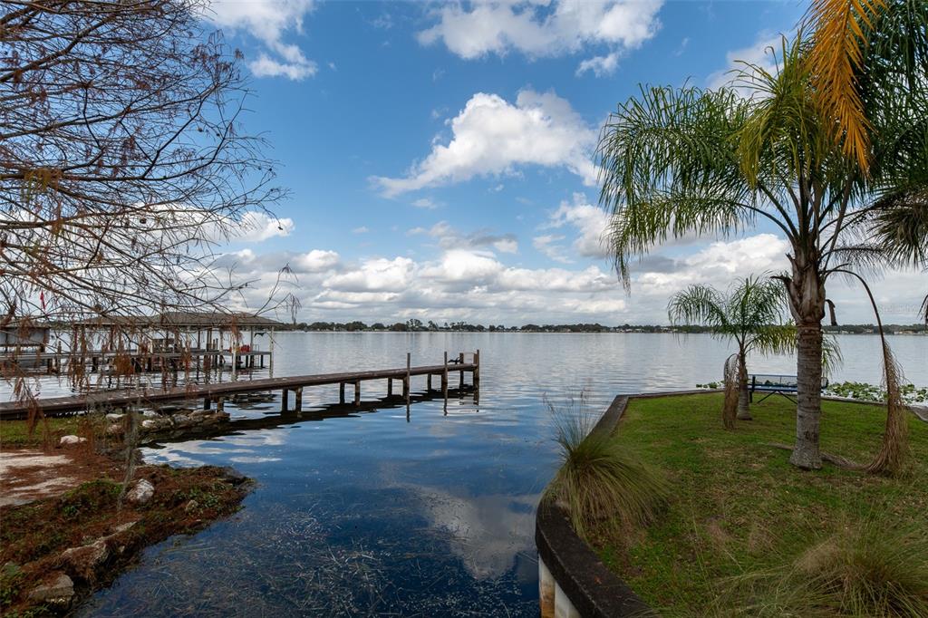 1862 Wind Willow Road Belle Isle, FL 32809 - Photo 29 of 42 a view of swimming pool with outdoor seating and lake