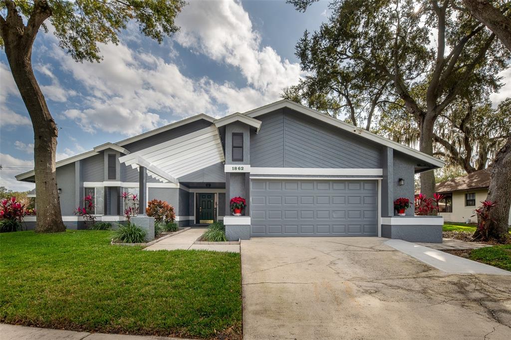 1862 Wind Willow Road Belle Isle, FL 32809 - Photo 32 of 42 a front view of house with yard and green space