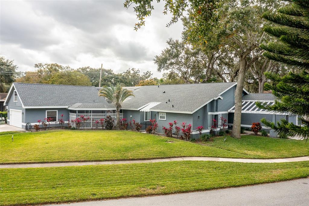 1862 Wind Willow Road Belle Isle, FL 32809 - Photo 33 of 42 a view of a house with a big yard and potted plants