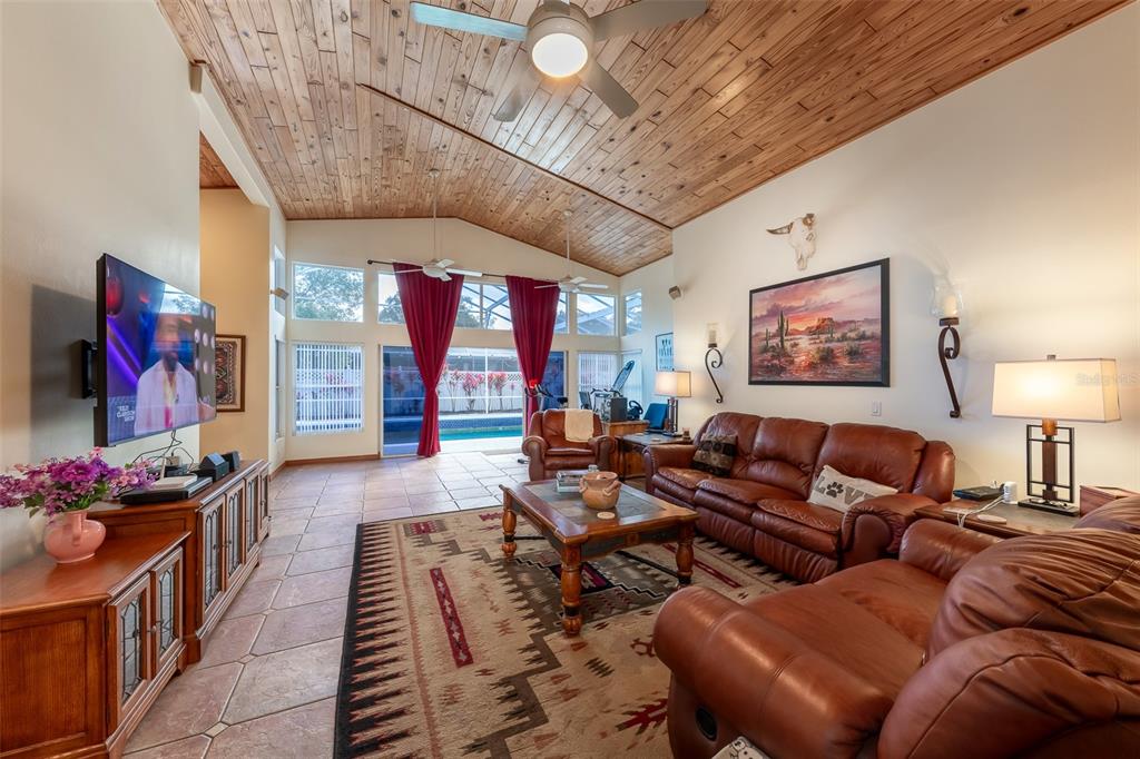 1862 Wind Willow Road Belle Isle, FL 32809 - Photo 4 of 42 a living room with furniture and a flat screen tv