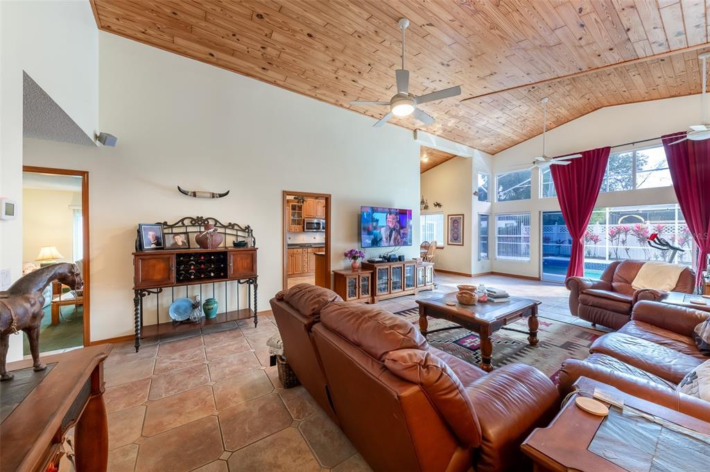 1862 Wind Willow Road Belle Isle, FL 32809 - Photo 5 of 42 a living room with furniture and a flat screen tv