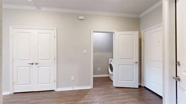 an empty room with wooden floor