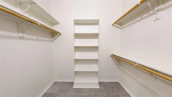 a view of an empty walk in closet