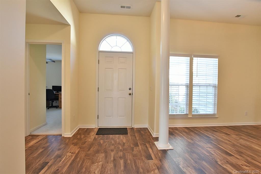 1132 Gower Street Fort Mill, SC 29708 - Photo 2 of 27 an empty room with wooden floor and a window