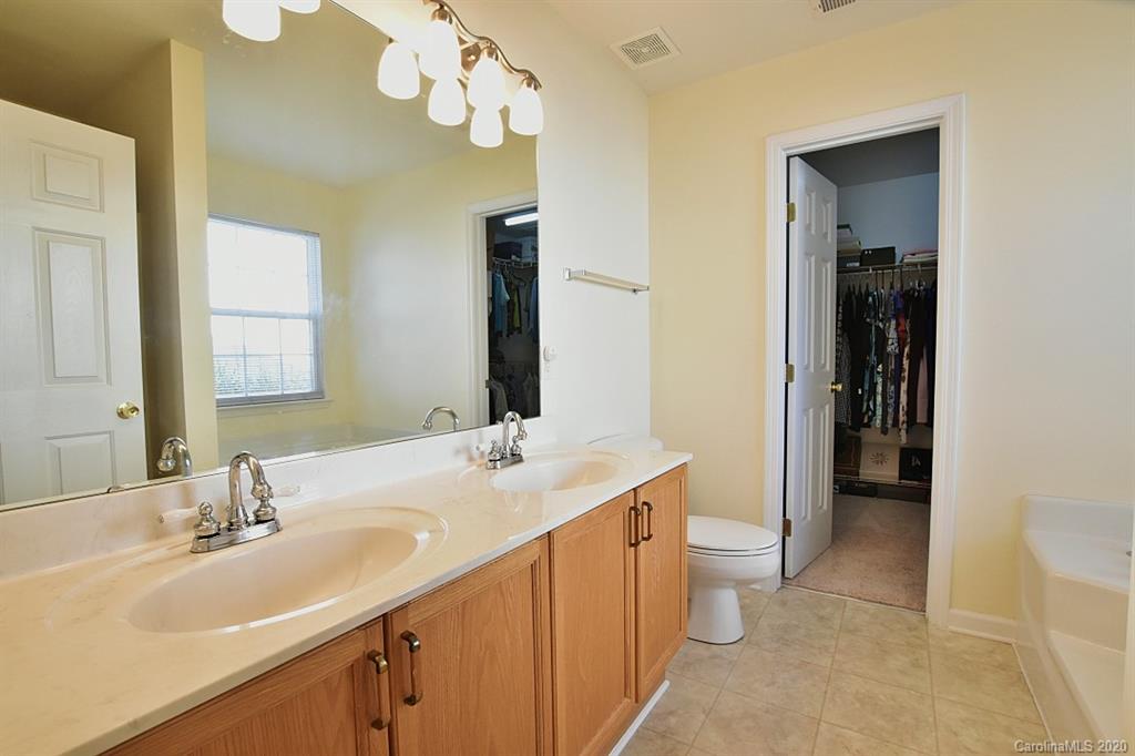 1132 Gower Street Fort Mill, SC 29708 - Photo 16 of 27 a bathroom with a sink a toilet and a mirror