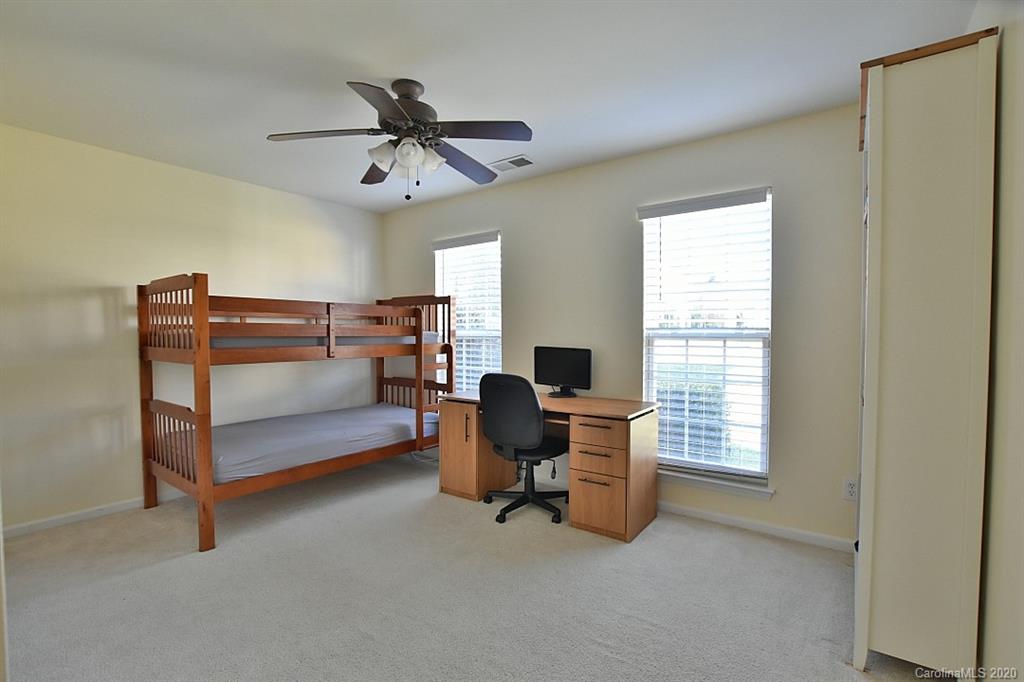 1132 Gower Street Fort Mill, SC 29708 - Photo 19 of 27 a view of a workspace with furniture and a window