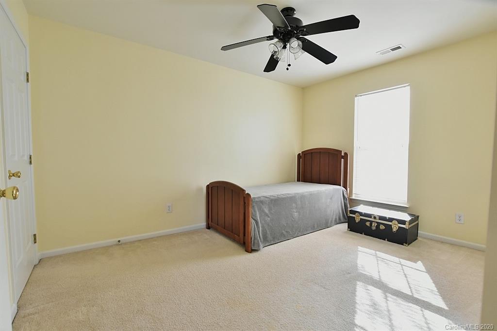 1132 Gower Street Fort Mill, SC 29708 - Photo 21 of 27 a living room with a couch and a ceiling fan