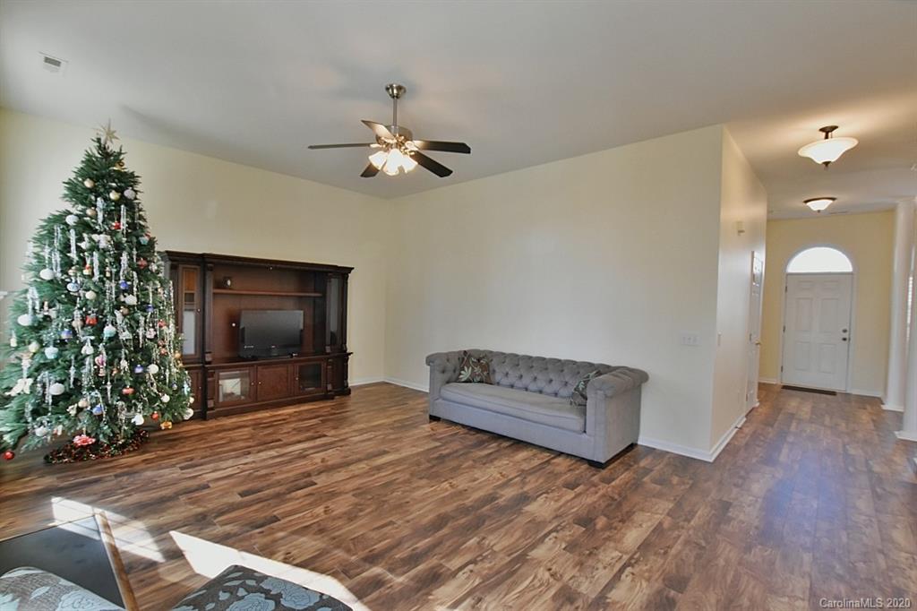 1132 Gower Street Fort Mill, SC 29708 - Photo 5 of 27 a living room with furniture and a flat screen tv