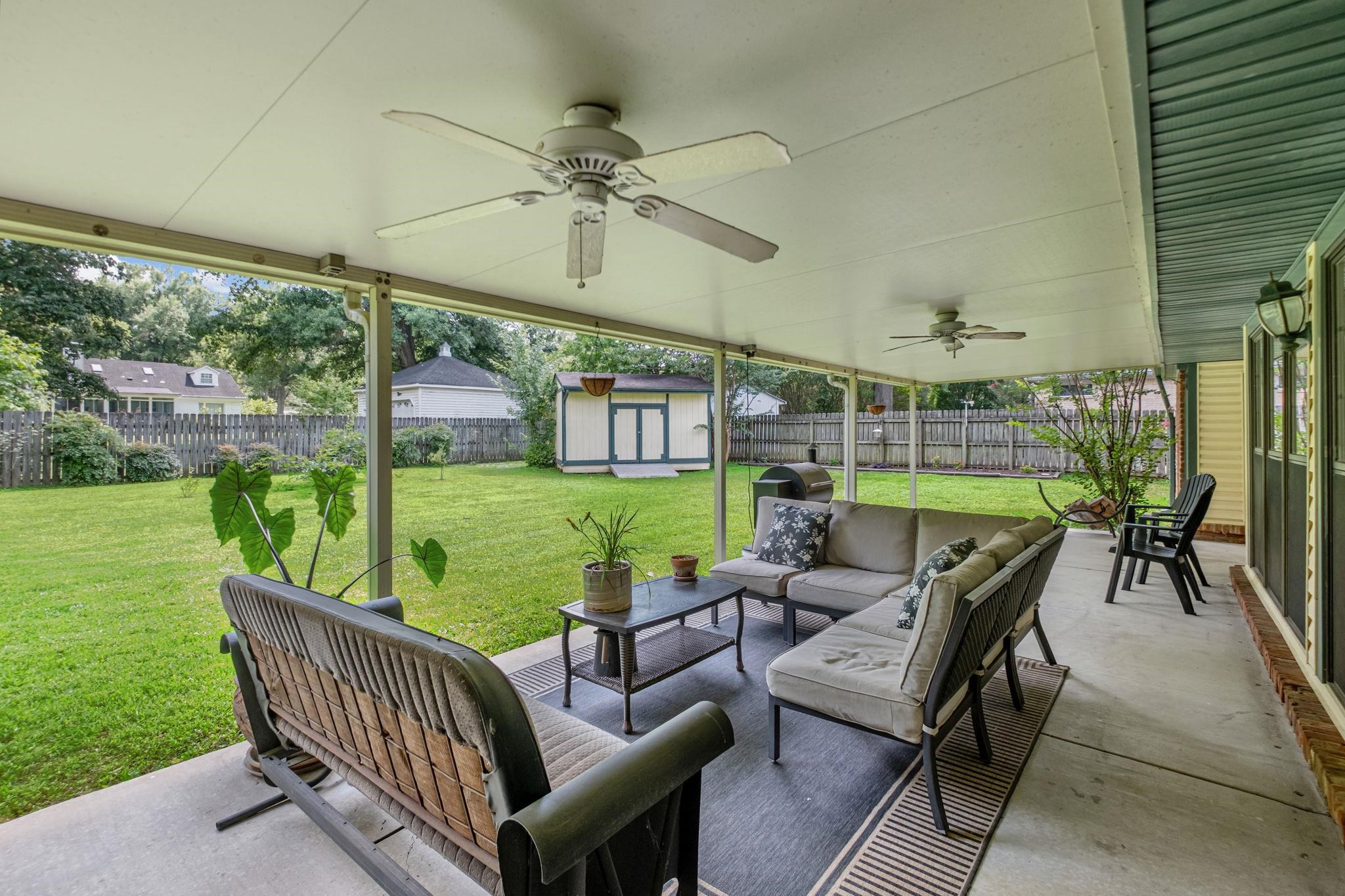 4729 Cedar Ridge Drive Millington, TN 38053 - Photo 33 of 40 Expansive covered patio with multiple ceiling fans and a concrete surface