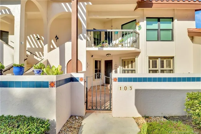 a view of living room filled with furniture and a potted plant