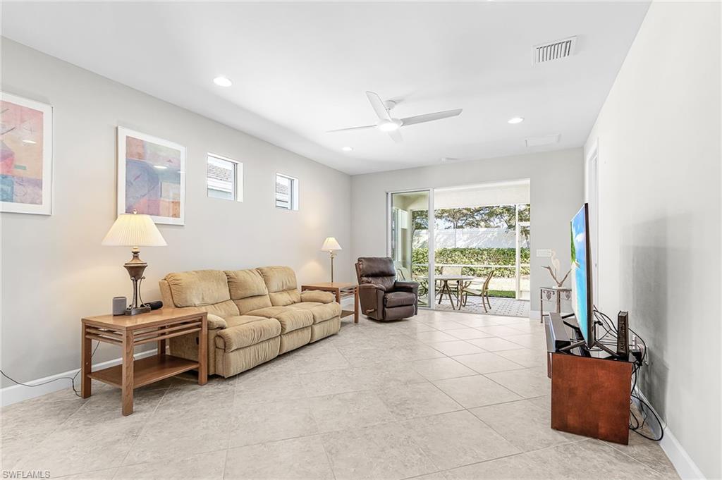 20131 Torch Key Way Estero, FL 33928 - Photo 12 of 47 Living area featuring plenty of natural light, a ceiling fan, recessed lighting, and light tile patterned flooring