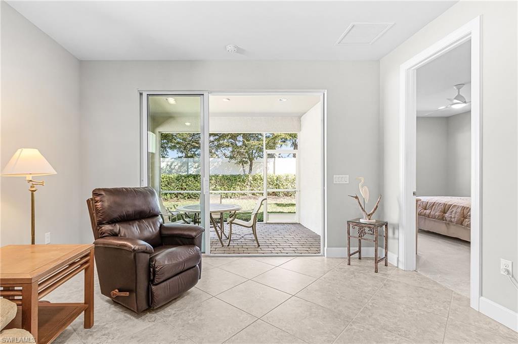 20131 Torch Key Way Estero, FL 33928 - Photo 14 of 47 Living area featuring light tile patterned floors
