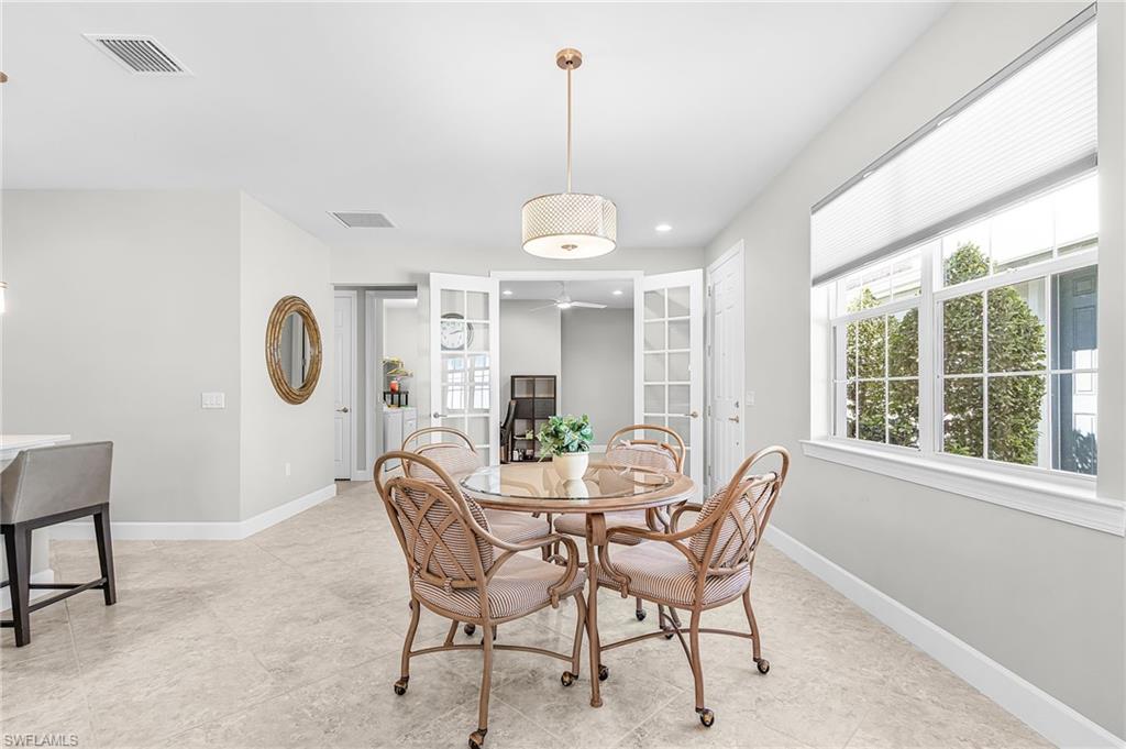 20131 Torch Key Way Estero, FL 33928 - Photo 15 of 47 Dining room with french doors, recessed lighting, and healthy amount of natural light