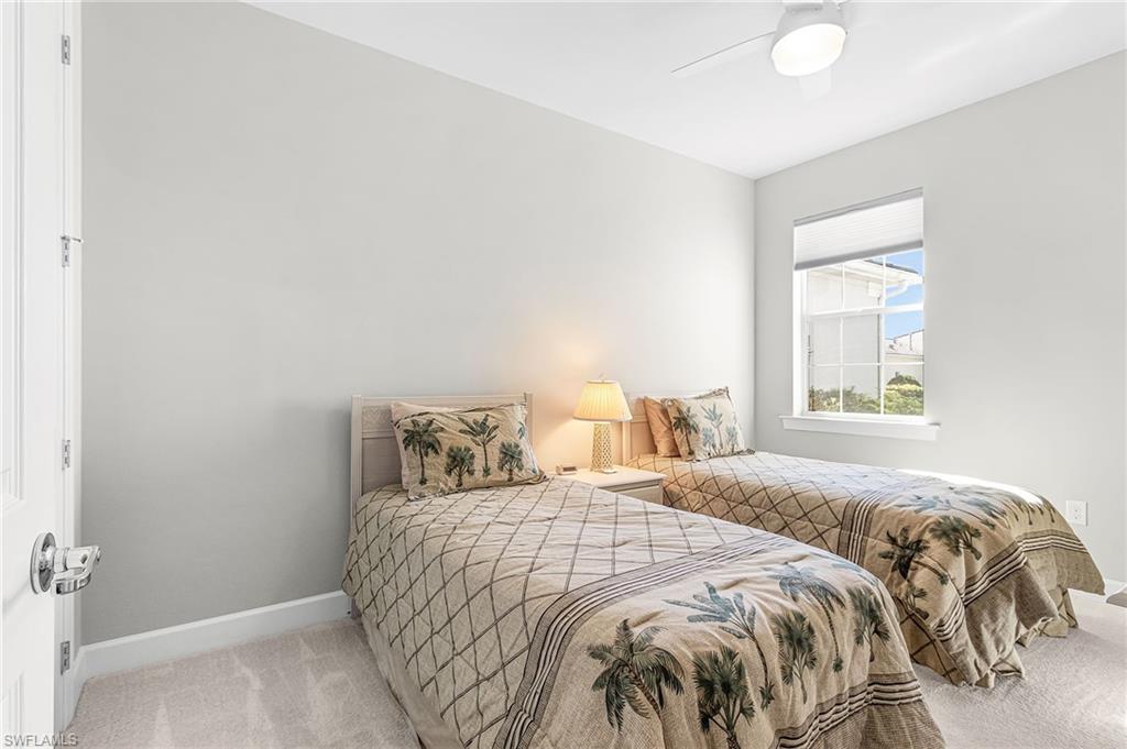 20131 Torch Key Way Estero, FL 33928 - Photo 24 of 47 Bedroom featuring light carpet and ceiling fan