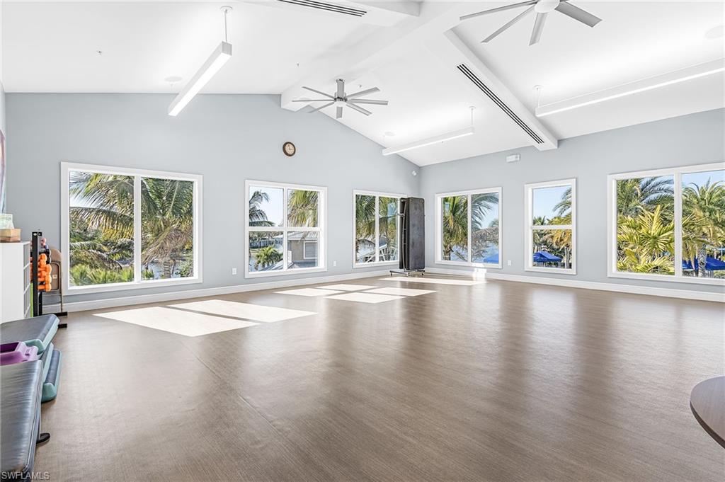 20131 Torch Key Way Estero, FL 33928 - Photo 31 of 47 Workout room with ceiling fan, healthy amount of natural light, and wood finished floors