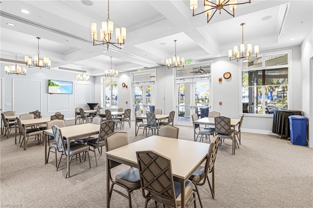 20131 Torch Key Way Estero, FL 33928 - Photo 33 of 47 Dining area with light colored carpet, crown molding, coffered ceiling, healthy amount of natural light, and recessed lighting