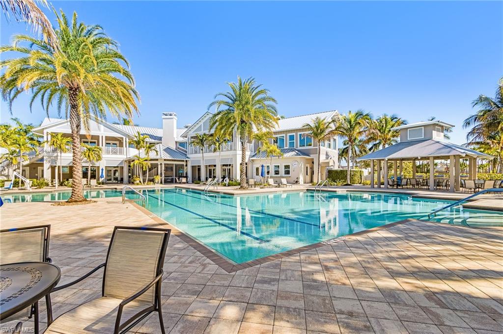 20131 Torch Key Way Estero, FL 33928 - Photo 36 of 47 Community pool with a patio