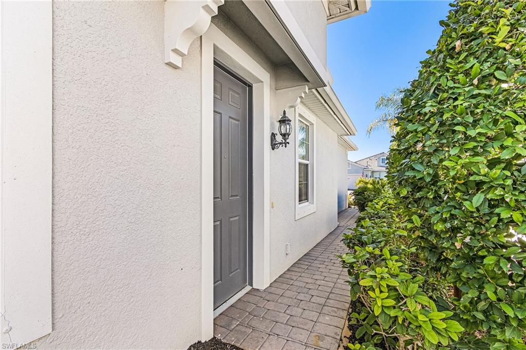 20131 Torch Key Way Estero, FL 33928 - Photo 5 of 47 Entrance to property featuring stucco siding