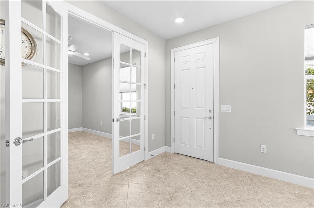 20131 Torch Key Way Estero, FL 33928 - Photo 6 of 47 Foyer with recessed lighting and french doors