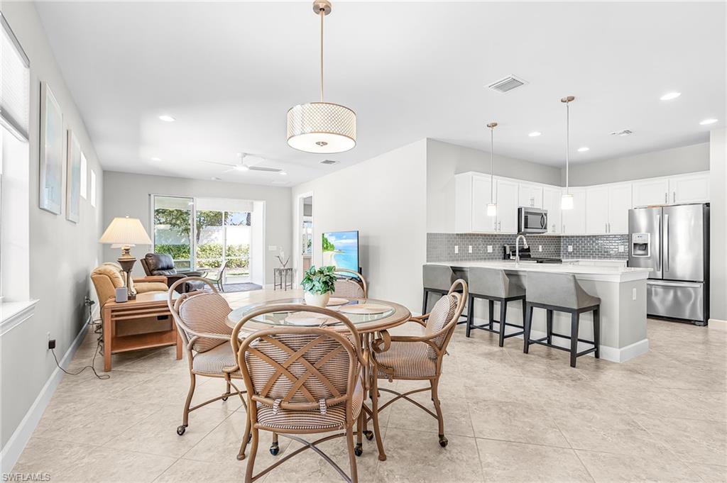 20131 Torch Key Way Estero, FL 33928 - Photo 8 of 47 Dining room featuring recessed lighting, ceiling fan, and light tile patterned floors