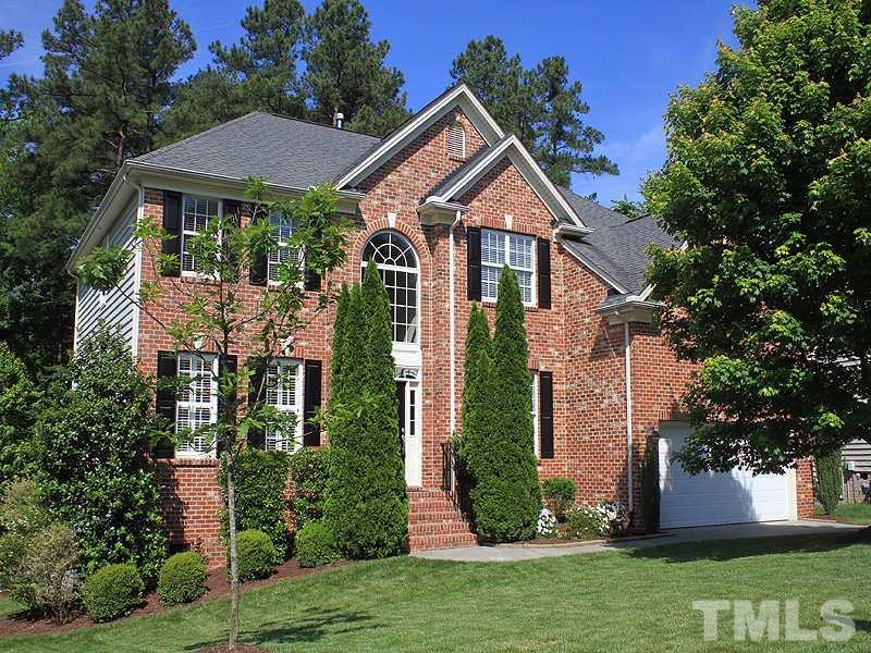 9223 Stone Mountain Road Raleigh, NC 27613 - Photo 1 of 17 a front view of a house with garden