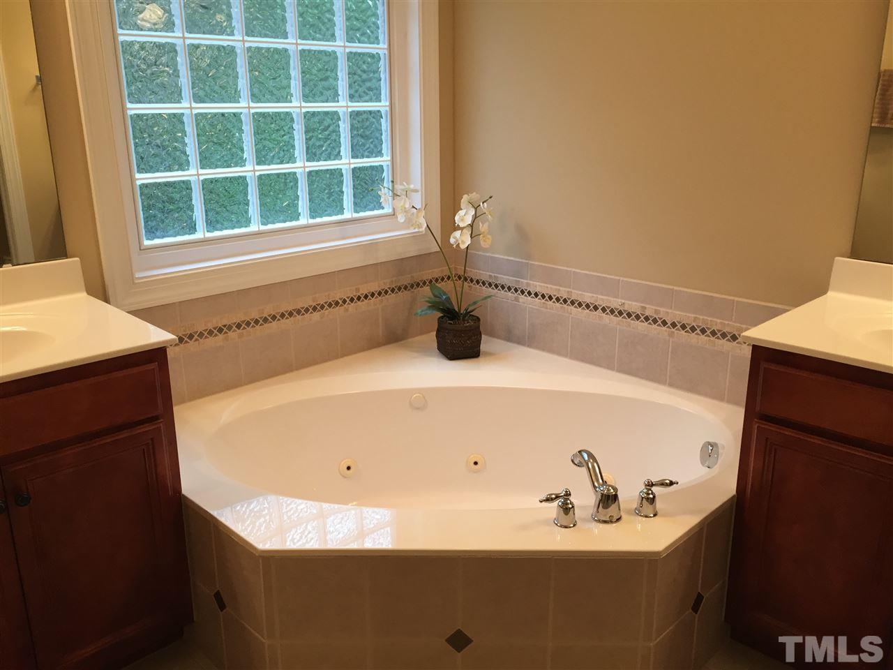 9223 Stone Mountain Road Raleigh, NC 27613 - Photo 13 of 17 a bathroom with a bathtub