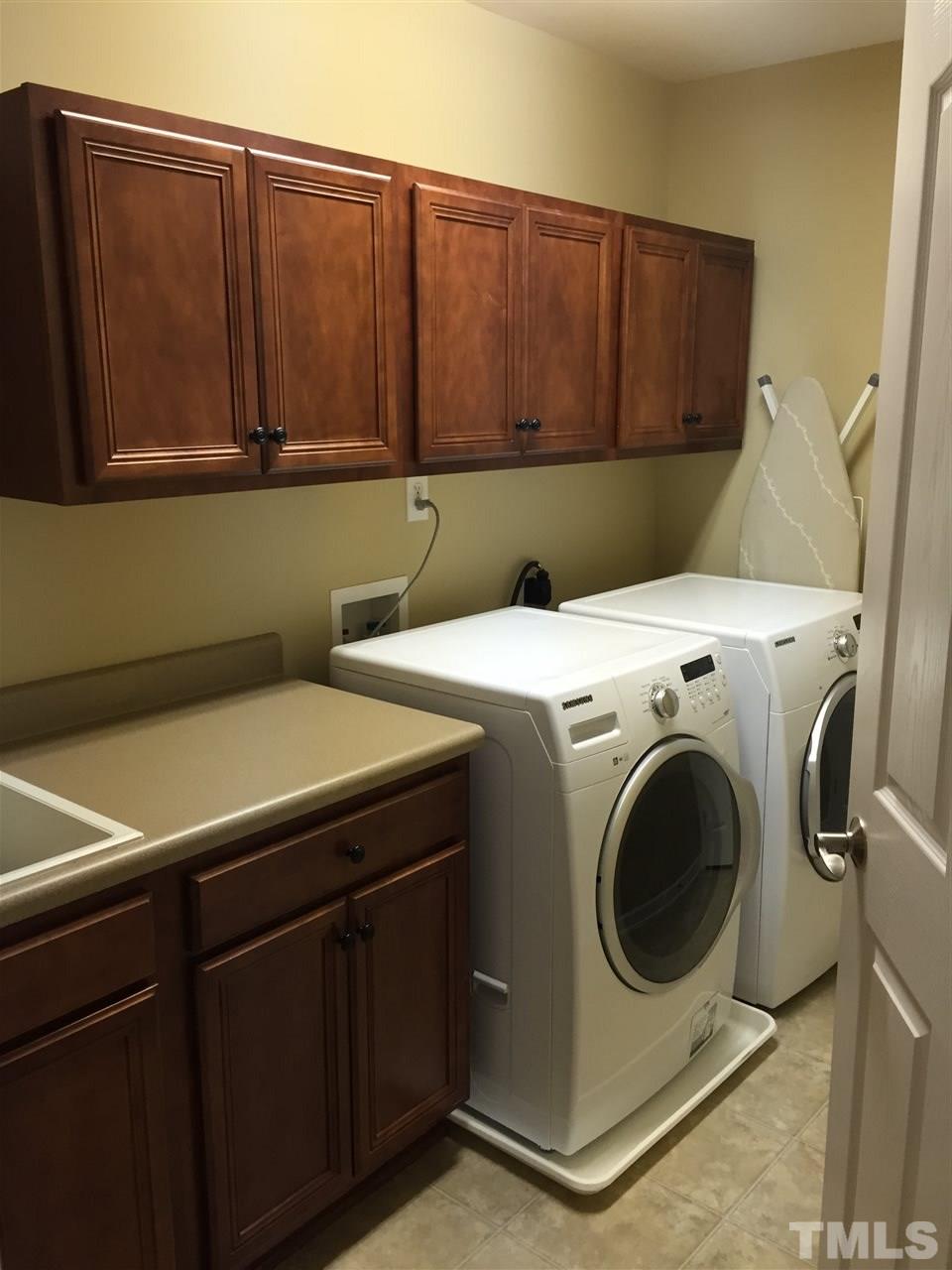 9223 Stone Mountain Road Raleigh, NC 27613 - Photo 15 of 17 a utility room with dryer and washer