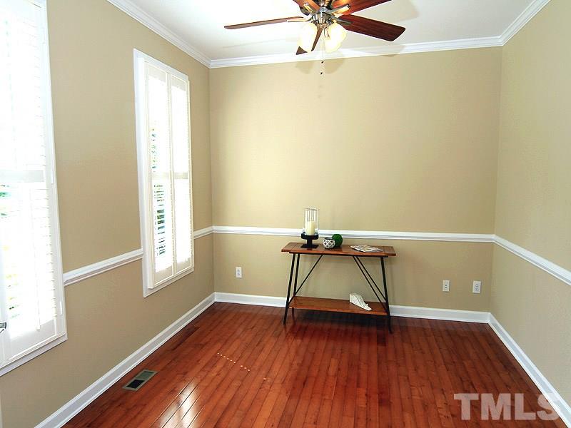 9223 Stone Mountain Road Raleigh, NC 27613 - Photo 10 of 17 a view of room with window and wooden floor