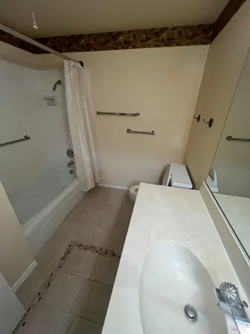 a view of a porch with furniture and garden