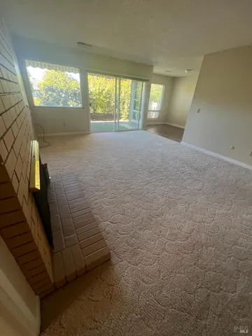 a view of a livingroom with a fireplace