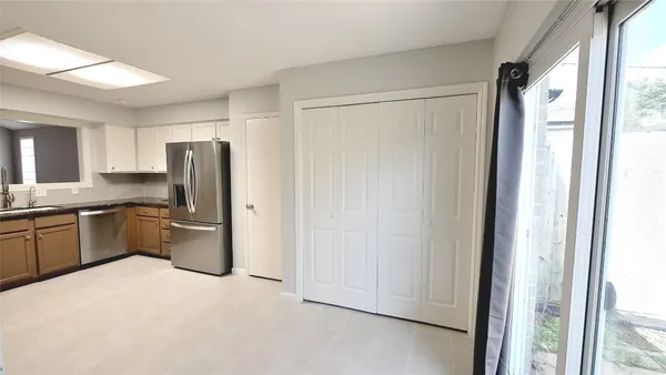 a kitchen with stainless steel appliances a refrigerator and a sink