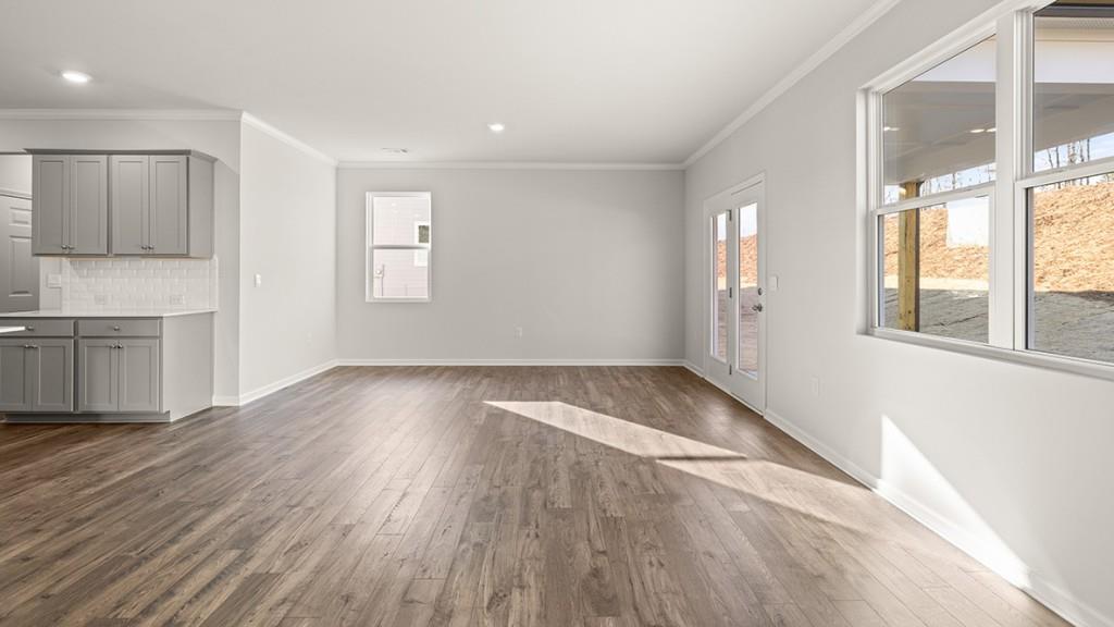 4083 Peregrine Way Gainesville, GA 30506 - Photo 12 of 34 a view of wooden floor and windows in a room