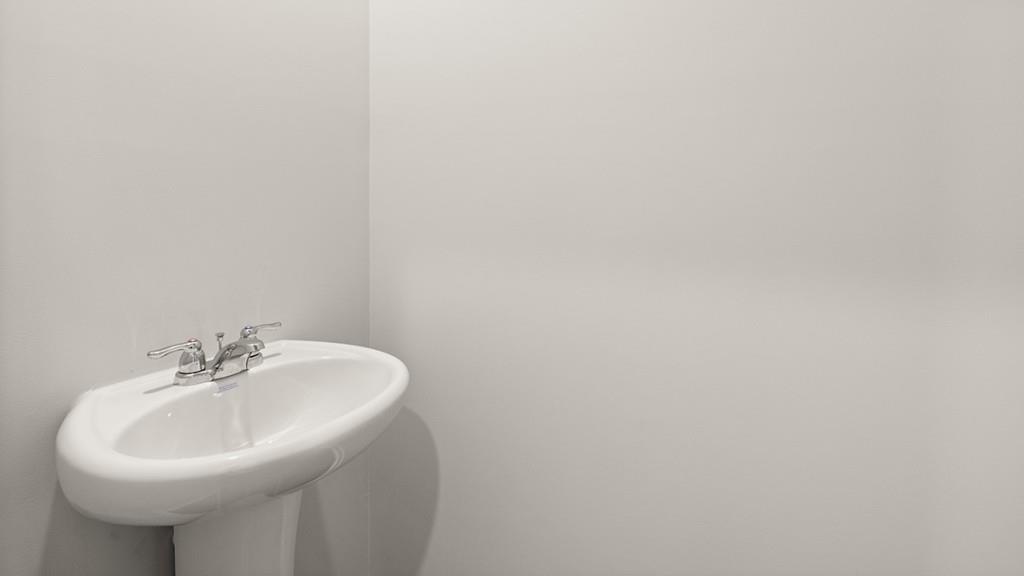 4083 Peregrine Way Gainesville, GA 30506 - Photo 14 of 34 a bathroom with a sink and a mirror