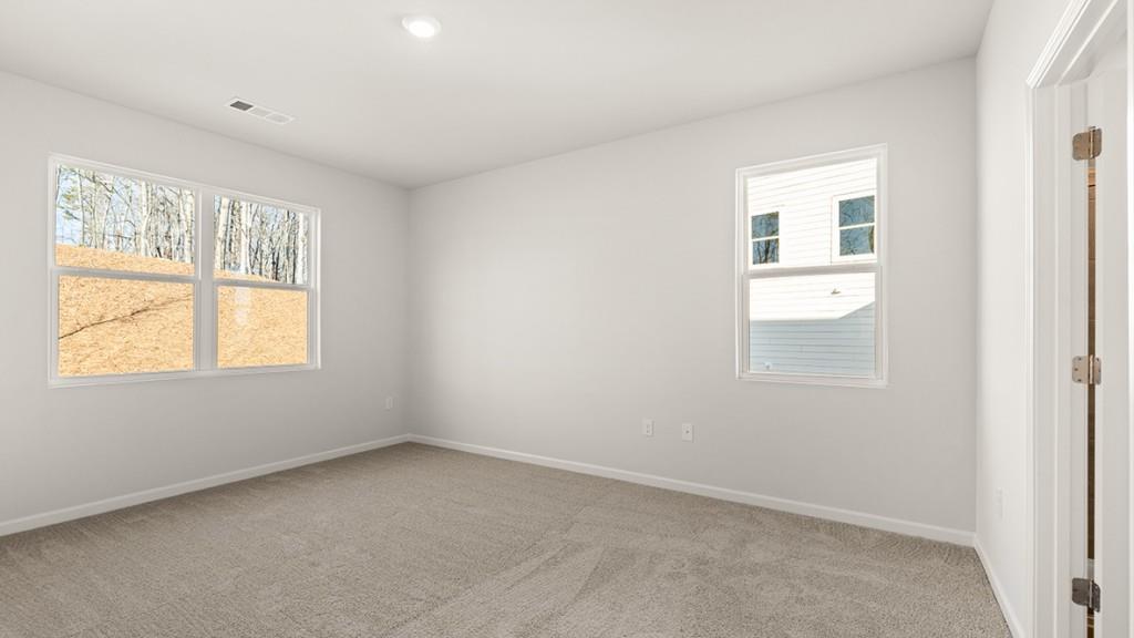 4083 Peregrine Way Gainesville, GA 30506 - Photo 15 of 34 an empty room with windows