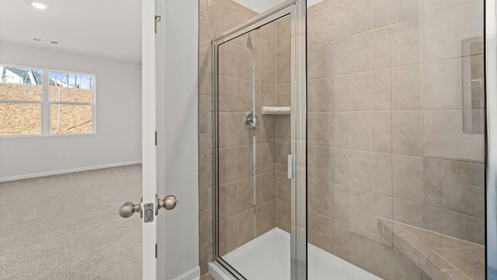 4083 Peregrine Way Gainesville, GA 30506 - Photo 19 of 34 a bathroom with a shower