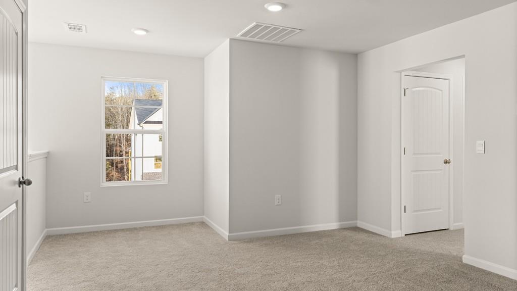 4083 Peregrine Way Gainesville, GA 30506 - Photo 21 of 34 an empty room with windows and closet