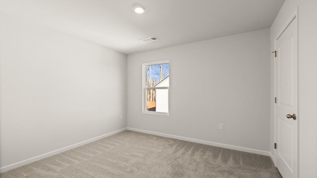 4083 Peregrine Way Gainesville, GA 30506 - Photo 22 of 34 an empty room with windows and closet