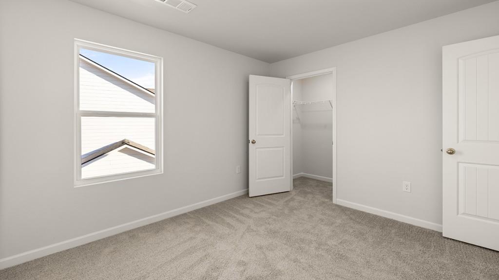 4083 Peregrine Way Gainesville, GA 30506 - Photo 23 of 34 an empty room with windows and closet