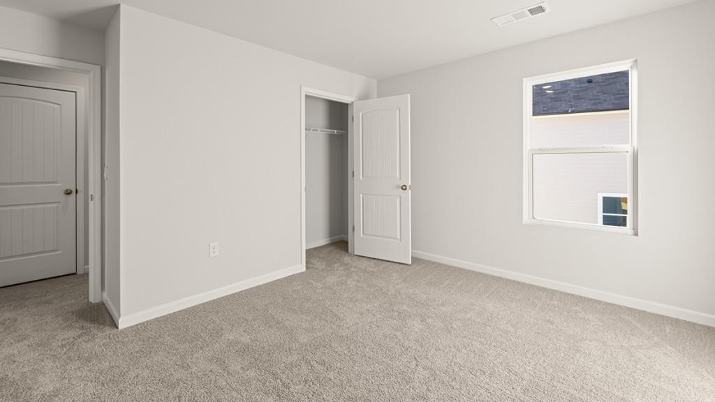 4083 Peregrine Way Gainesville, GA 30506 - Photo 25 of 34 a view of an empty room with closet and a window
