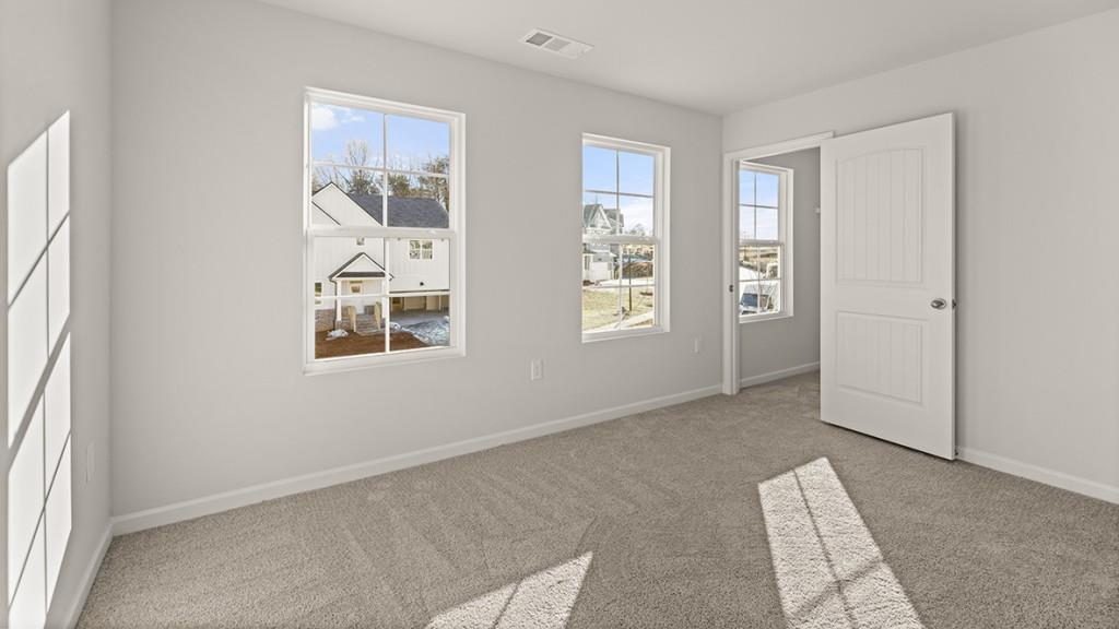 4083 Peregrine Way Gainesville, GA 30506 - Photo 27 of 34 an empty room with windows