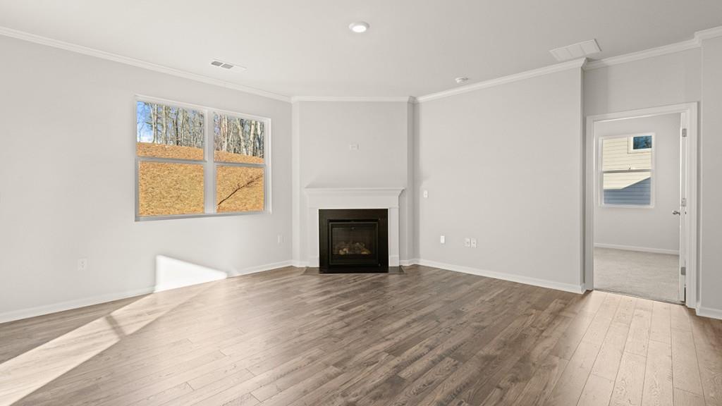 4083 Peregrine Way Gainesville, GA 30506 - Photo 10 of 34 an empty room with windows and a fireplace