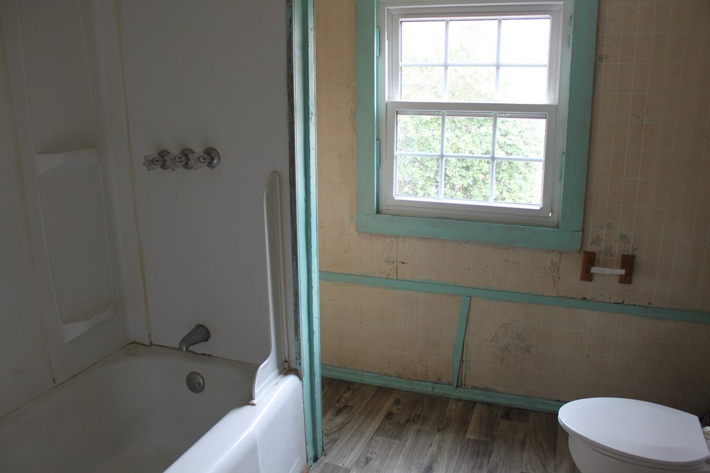 2 Wilson Street Manchester, GA 31816 - Photo 12 of 18 a bathroom with a sink and bathtub with toilet
