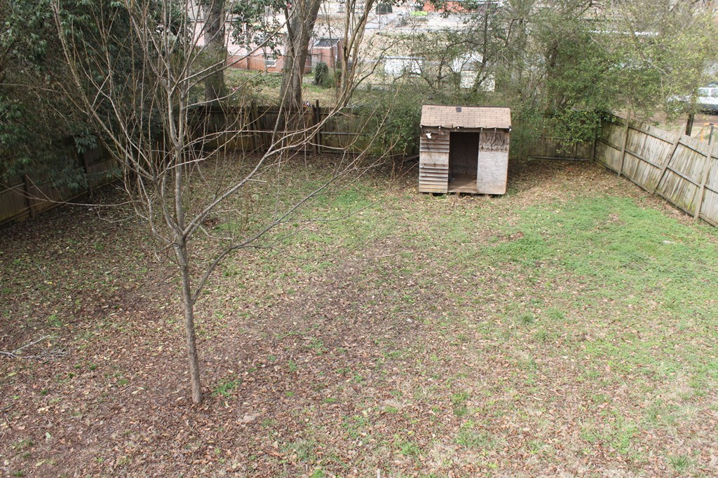 2 Wilson Street Manchester, GA 31816 - Photo 17 of 18 a backyard of a house with table and chairs
