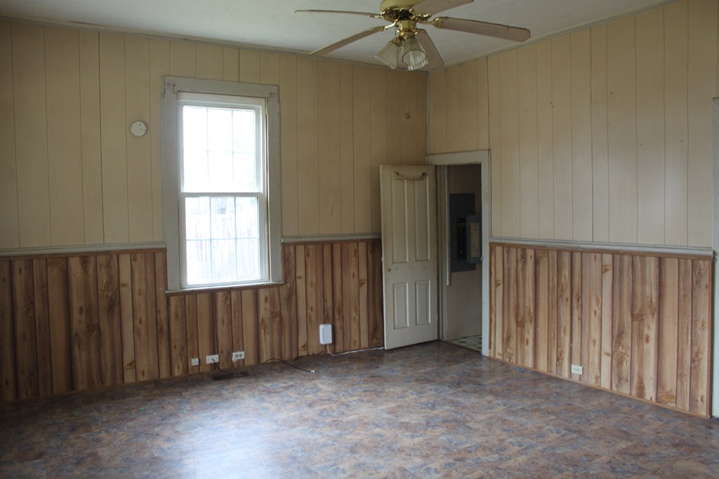 2 Wilson Street Manchester, GA 31816 - Photo 3 of 18 an empty room with windows and fan