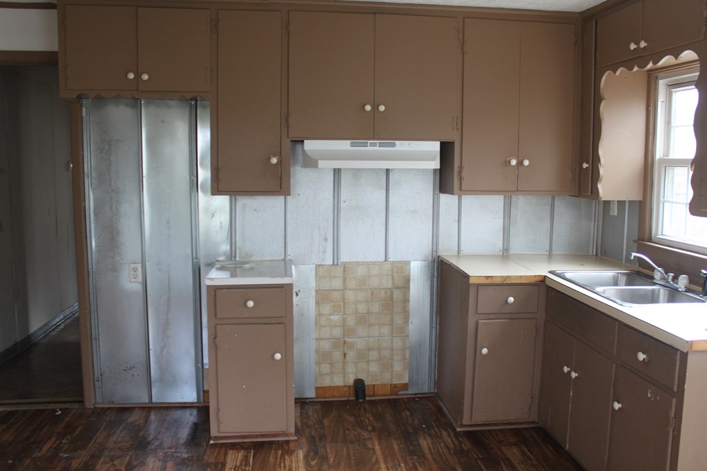 2 Wilson Street Manchester, GA 31816 - Photo 4 of 18 a kitchen with cabinets and wooden floor