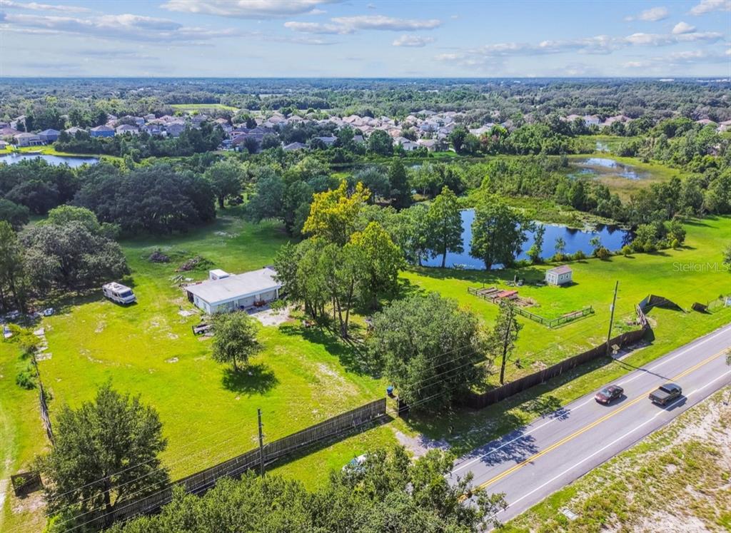 12321 Shady Hills Road Spring Hill, FL 34610 - Photo 11 of 30 an aerial view of a residential houses with outdoor space and trees all around