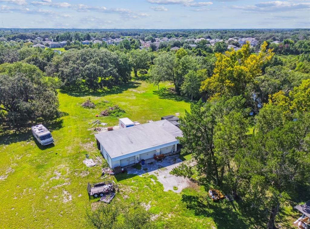 12321 Shady Hills Road Spring Hill, FL 34610 - Photo 24 of 30 a view of a house with a yard