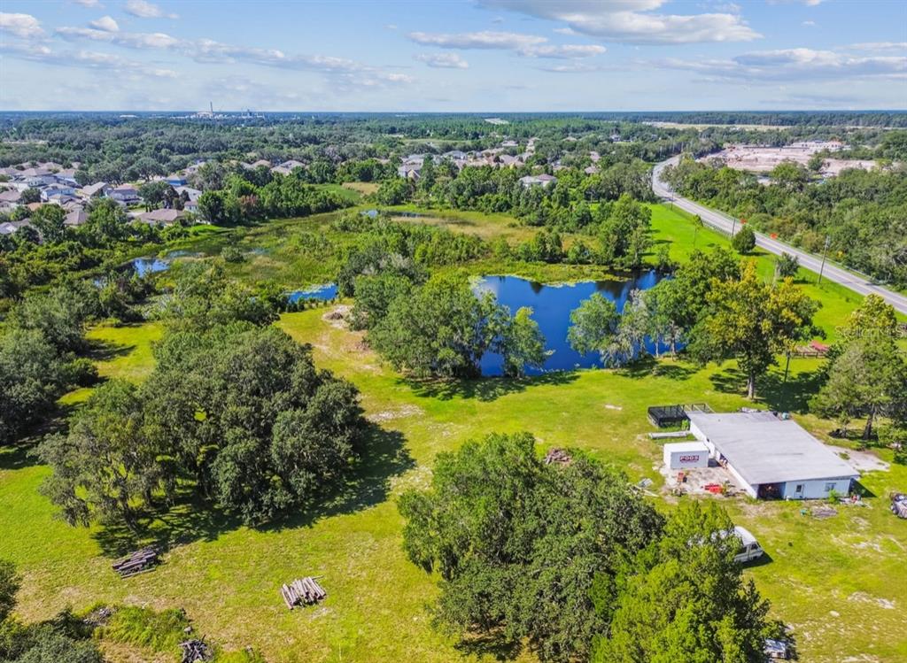 12321 Shady Hills Road Spring Hill, FL 34610 - Photo 26 of 30 an aerial view of a houses with yard