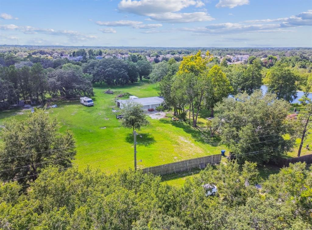 12321 Shady Hills Road Spring Hill, FL 34610 - Photo 7 of 30 a view of a lake with a yard